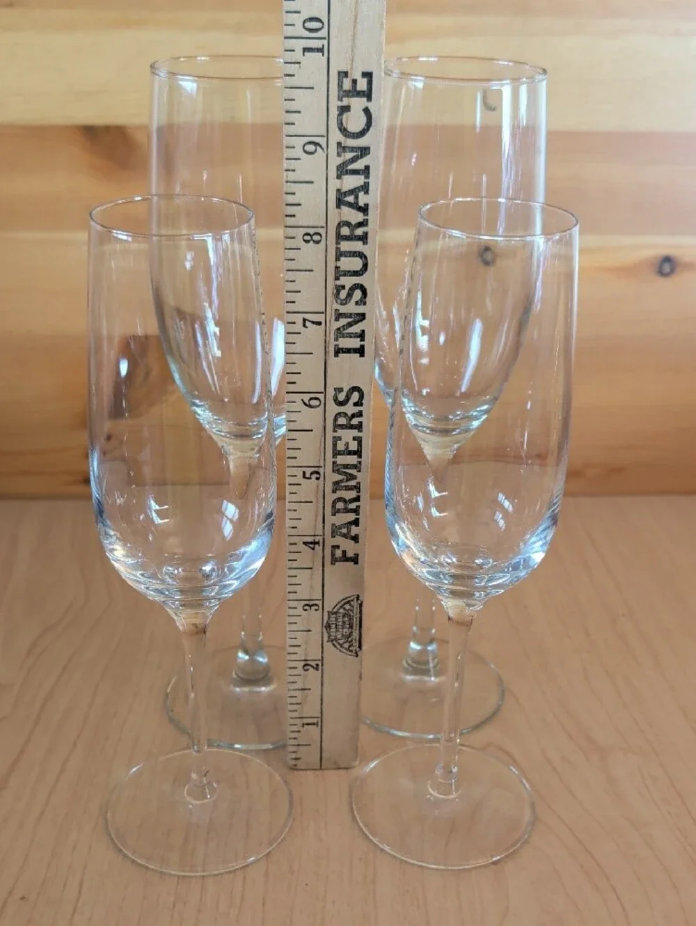 4 Clear Glass Champagne Flutes. 2 Tall & 2 Smaller.